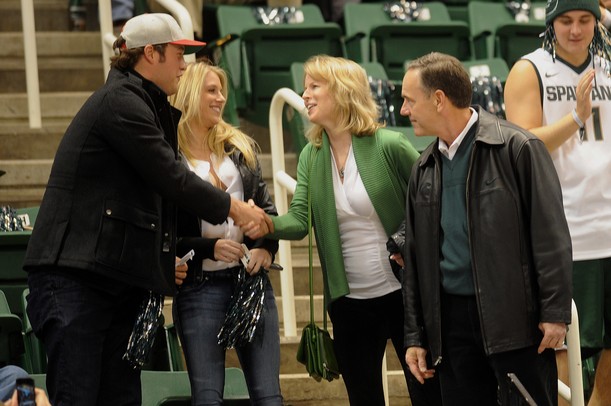 Detroit Lions quarterback Matthew Stafford shakes hands with Becky Dantonio as her husband and Michigan State head football coach, Mark stands by at Breslin Center in East Lansing on Tuesday, Feb. 12. Melanie Maxwell I AnnArbor.com